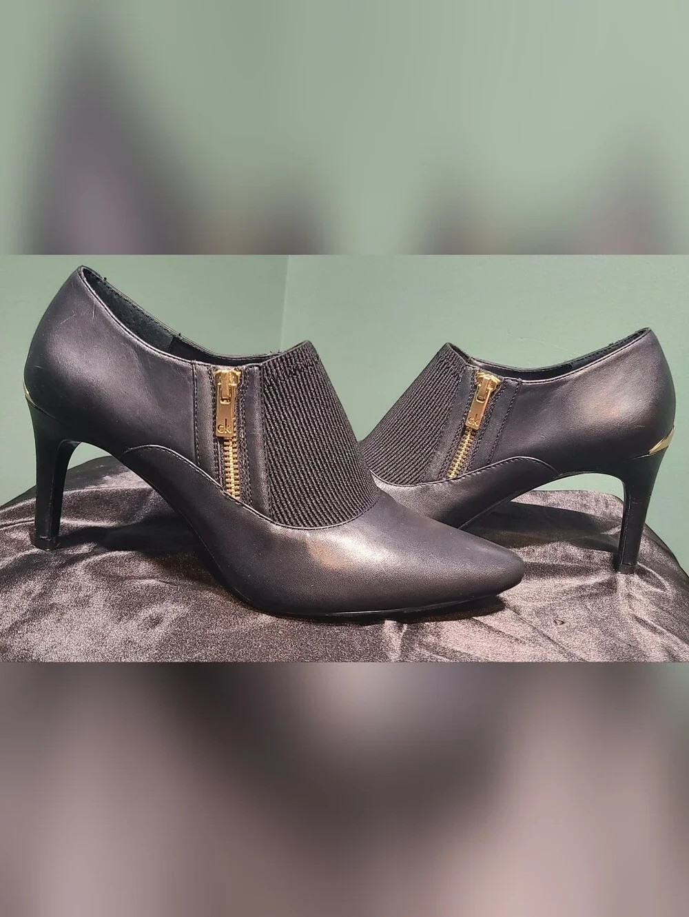 Calvin Klein Black Pointed-Heel Slip-On Pumps with Gold Zipper